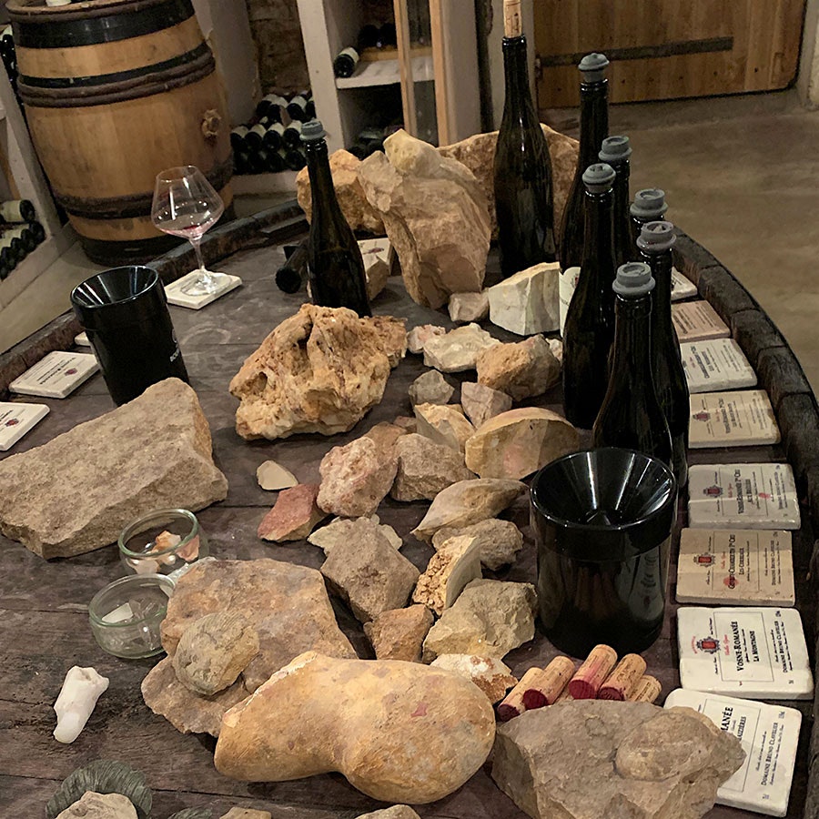 In Bruno Clavelier's cellar, a table displays rocks from the domaine's many different vineyard sites.